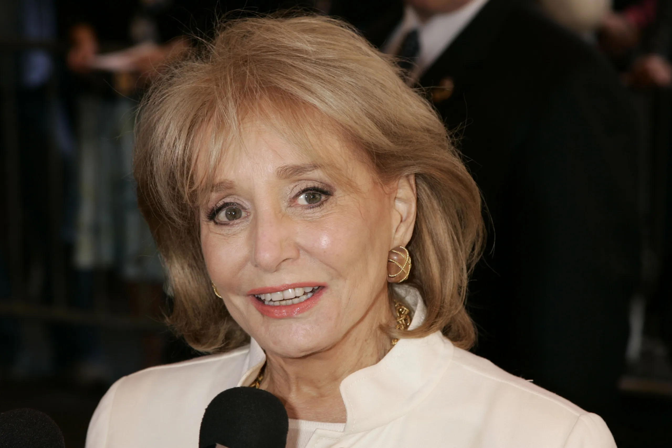 Barbara Walters with a microphone